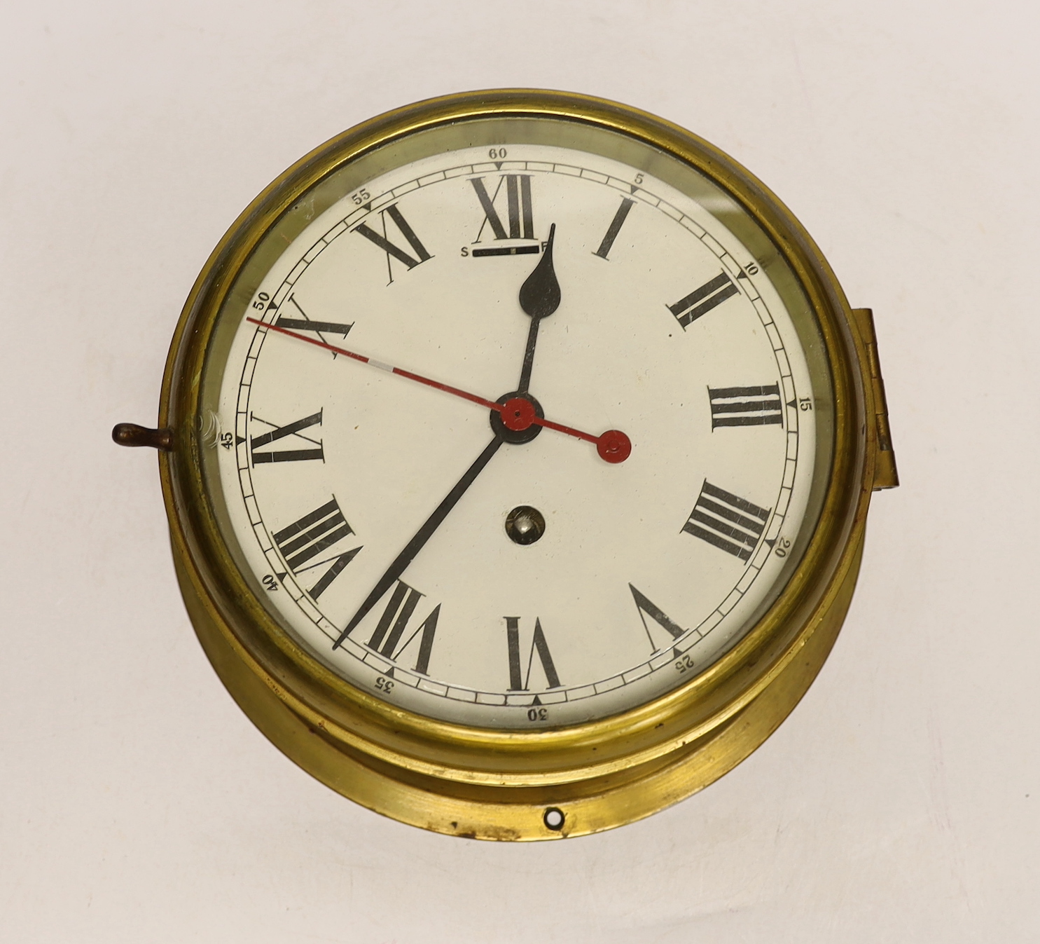 A brass bulkhead timepiece, 19.5cm